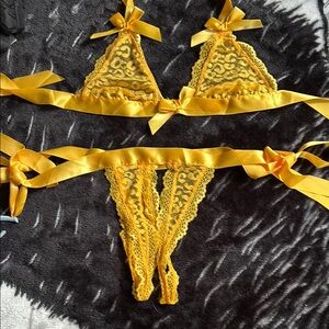 Yellow Frederick’s of Hollywood bra/thong matching set. One Size